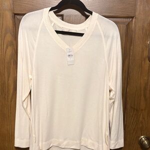 This V neck ivory color sweater.